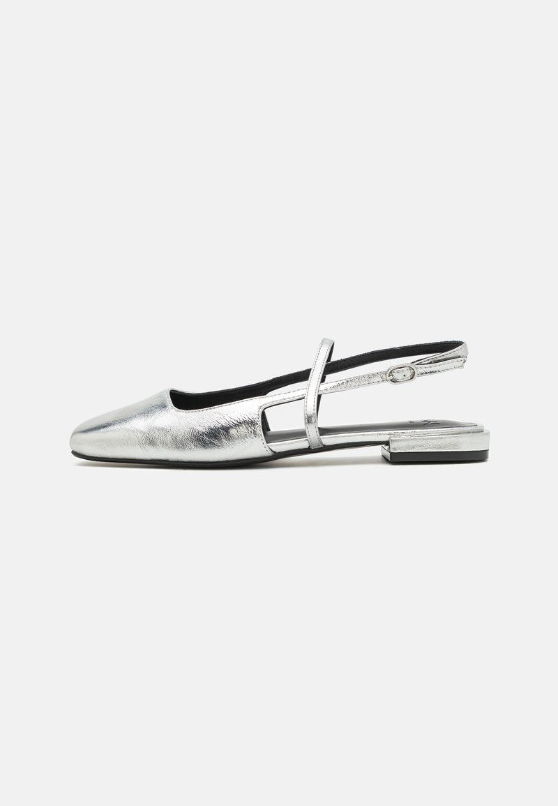 Silver metallic slingback shoe with a rounded toe, low block heel, and cut-out design on the side. Smooth texture and adjustable strap.