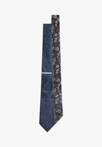 Unselected, navy blue floral polka dot