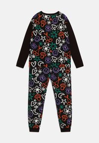 Musta one-piece haalari, joka esittelee värikkäitä, leikkisiä kuvioita kukista, tähdistä, sydämistä ja erilaisista hymyilevistä kasvoista. Pitkät hihat ja resoroidut nilkat.