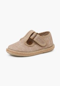 Tan fabric shoe with textured design, Velcro strap, rounded toe, and braided jute sole. Smooth interior and sturdy stitching accents.