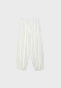 Pantalon blanc ample avec taille élastique et poignets élastiques, fabriqué en tissu léger.