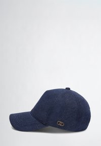 Navy blue fabric cap with a curved brim, featuring a stitched texture and a gold-tone logo accent on the side.