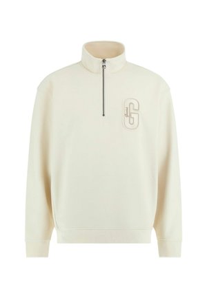 Crème-kleurige fleece pullover met hoge kraag, half-rits sluiting en geborduurd logo op de borst. Gestructureerde stof met ribbelmanchetten.