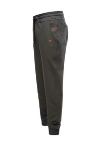Pantalones de chándal gris oscuro con cintura elástica, bolsillos laterales y puños acanalados. Presenta detalles impresos en naranja. Material mezcla de algodón.