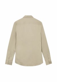 Bežinė ilga rankovė marškiniai rodoma iš nugaros su apykakle, užsegamomis rankovėmis ir lygiu, glotniu audinio tekstūra.