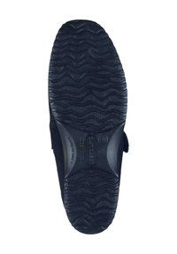 Black rubber shoe sole with a textured, wavy pattern. Features a smooth, rounded edge and branding embossed on the center.