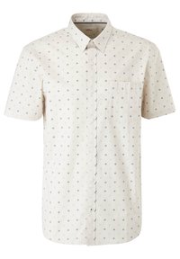 Chemise beige à manches courtes, boutonnée, avec un petit motif floral bleu foncé et une poche poitrine.
