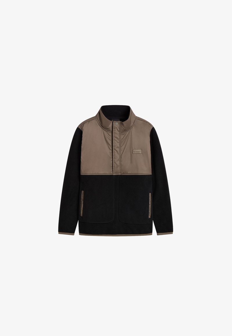 Veste polaire à col montant avec un dessus en nylon beige, un bas noir, fermeture éclair et deux poches latérales. Présente un patch de marque sur la poitrine.