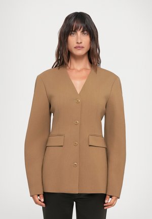 Brown blazer with a V-neck, front buttons, and side pockets. Features structured shoulders, smooth texture, and tailored design.