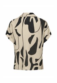 Short-sleeve shirt in beige with abstract black pattern, featuring a collar and textured fabric. Modern fit with curved hemline.