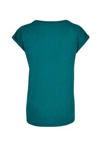 Teal kortærmet T-shirt med rund hals, afslappet pasform og oprullede ærmer; glat bomuldsstof, ingen mønstre eller ekstra detaljer.
