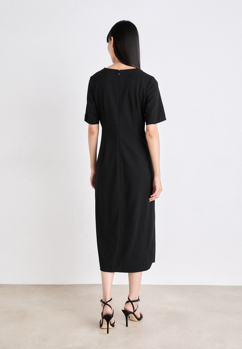 Robe Pull DKNY En Laine Mérinos Fine 100% - Taille P (Fit Size 8) - Noire - Neuf Sans étiquettes