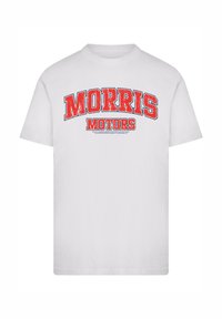 White cotton t-shirt featuring bold red graphic text "MORRIS MOTORS" in an arched design with slightly distressed detailing.