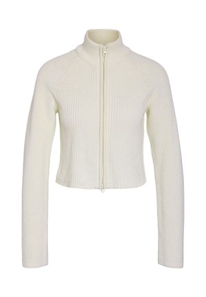 Gekürzter, cremefarbener Strickpullover mit hohem Kragen, durchgehendem Reißverschluss und Rippstruktur. Mit langen Ärmeln und enganliegender Passform.