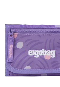 Purple wallet with abstract patterns in lighter shades. Features a zip closure and an embroidered logo in white on the front.