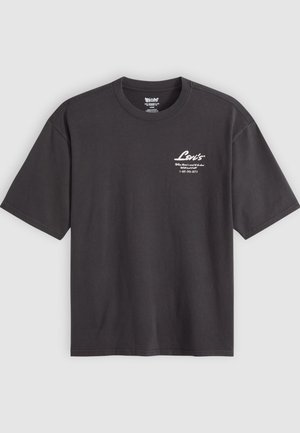 Black cotton T-shirt with a crew neck, short sleeves, and white printed logo details on the upper left chest. Smooth texture, relaxed fit.