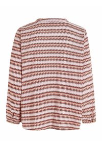 Blusa a maniche lunghe con un motivo a zigzag nei colori rosso, rosa e bianco. Tessuto leggero; polsini elastici; scollatura rotonda.