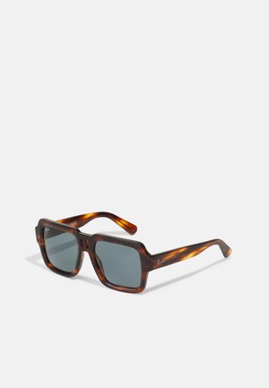 Square sunglasses with a tortoiseshell acetate frame, gray lenses, and a glossy finish. Features a logo on the temple.
