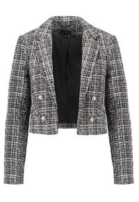Veste courte en tweed noir et blanc avec un col cranté, un design croisé et deux boutons décoratifs en perles. Doublée en noir.