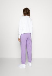 Champion Teplákové kalhoty - lilac