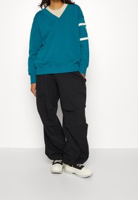 Nike Sportswear Mikina - mottled teal