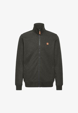 Dunkelgraue Zip-Jacke aus weichem Stoff, mit Stehkragen, seitlichen Taschen und einem kleinen Lederlogo-Patch auf der Brust.