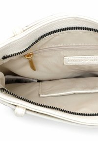 Valge nahast käsitööna valmistatud käekoti siseosa beežist kangast voodriga, must tõmblukk, kuldse tõmbluku tõmbaja ja taskuga.