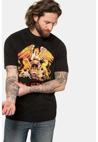Sort bomulds T-shirt med et farverigt grafisk motiv af en øgle, løver og en krone med teksten "QUEEN" i fed rød nederst.