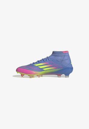 Football boots in blue, pink, and green gradient. Features a high ankle collar, textured synthetic upper, and clear plastic studded sole.