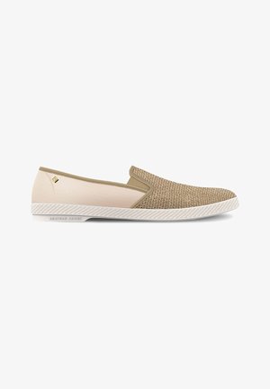 Slip-on shoes featuring a textured tan fabric upper, beige panel, and white rubber sole with a textured edge. Minimal branding on side.