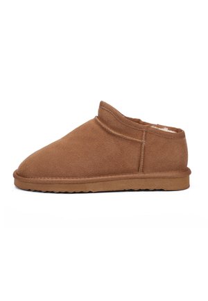 Brown suede slip-on shoe with a soft interior lining, rounded toe, and low, textured rubber sole. Seam detail along the sides.