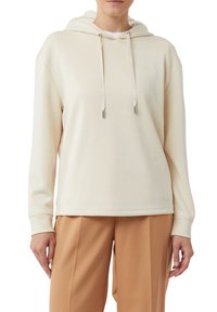 Felpa crema con tasca a marsupio, cappuccio con coulisse e maniche lunghe. Realizzata in tessuto morbido con una vestibilità rilassata, abbinata a pantaloni beige.