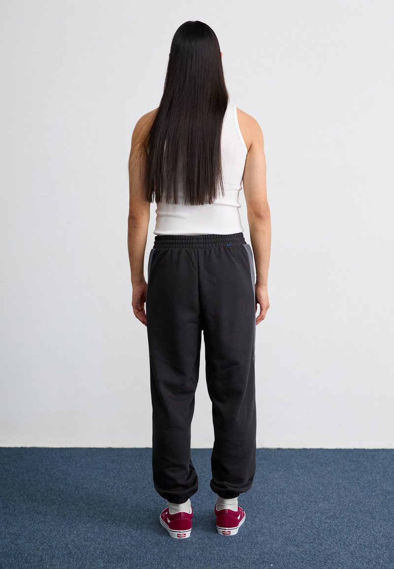 Puma BMW MMS LIFESTYLE PANTS - Teplákové kalhoty - black