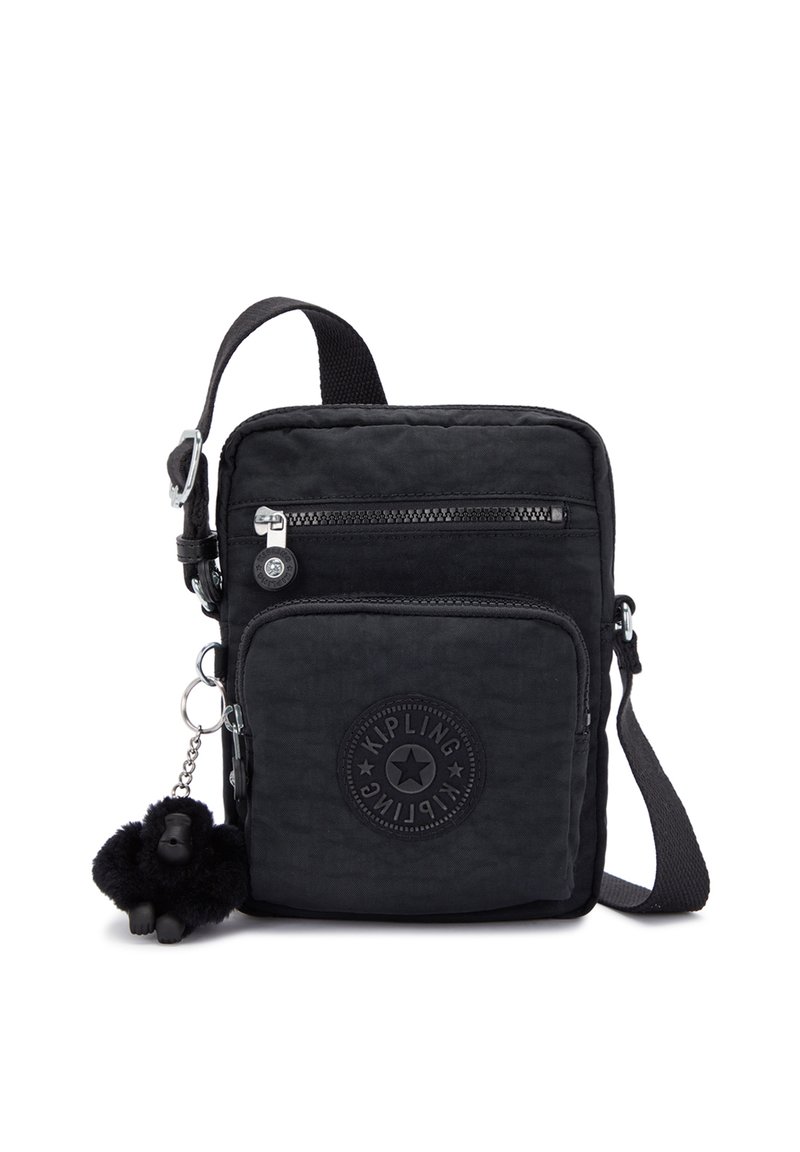 Black nylon crossbody bag featuring a front zipper pocket, logo patch, and a detachable monkey keychain. Adjustable strap included.