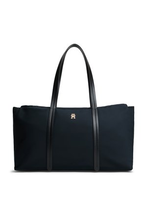 Sort rektangulær tote taske med lange sorte håndtag og et lille gullogo centreret nær toppen foran.