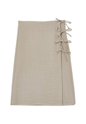Beige wrap skirt made from soft fabric, featuring a smooth texture and lace-up accents along one side.