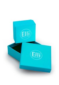 Turkise gaveæsker med en glat overflade, der har et hvidt cirkulært logo på forsiden. Én er åben og afslører et grønt indre.