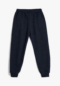 Mørkeblå joggers lavet af blødt stof, med en elastisk talje og ribkanter for en tætsiddende pasform. Ingen synlige mønstre eller beslag.
