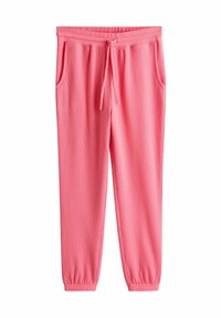 Ružové tepláky vyrobené z textúrovaného materiálu, s elastickým pásom so šnúrkou na stiahnutie, vreckami na bokoch a elastickými manžetami na členkoch.