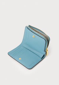 Light blue leather wallet with a zip closure, interior card slots, and a snap button. Featuring textured material and gold hardware accents.