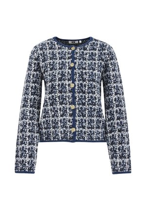 Gilet à motif carreaux bleu marine et blanc, avec des manches longues, un col rond et des boutons dorés sur le devant. Tissu texturé sur l'ensemble.