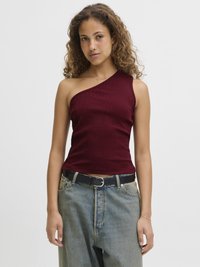 Maroon ribbed tank top with one shoulder design, paired with light blue wide-leg jeans and a black belt. Textured fabric, casual fit.