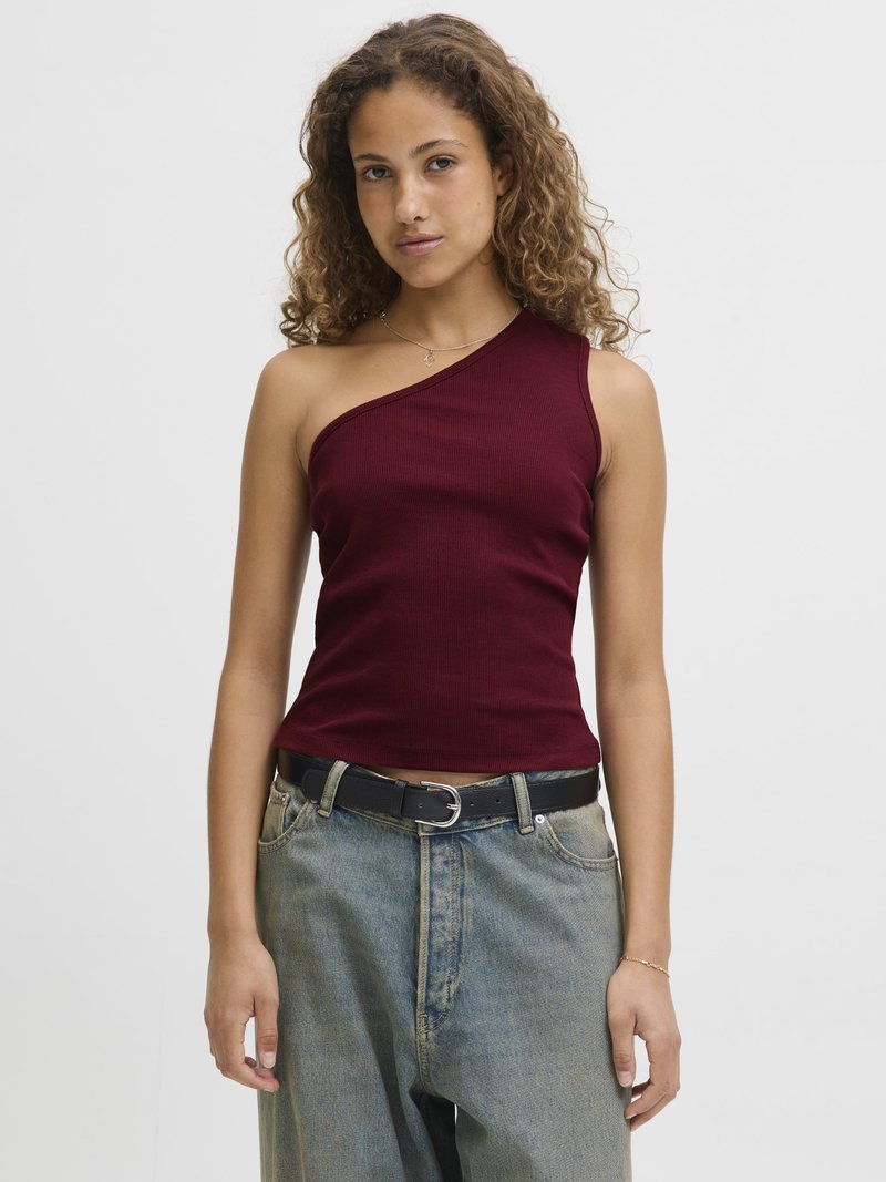 Maroon ribbed tank top with one shoulder design, paired with light blue wide-leg jeans and a black belt. Textured fabric, casual fit.