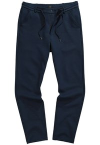 Marineblaue Sweathose mit einem Kordelzugbund, seitlichen Taschen, zulaufenden Beinen und einem weichen, strukturierten Stoff. Sichtbare Kontrastnähte.