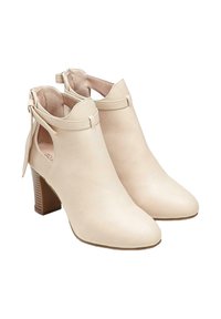 Stivaletti beige realizzati in pelle liscia, con punta affusolata, lati a taglio e tacco medio con base testurizzata. Fiocco decorativo sul retro.