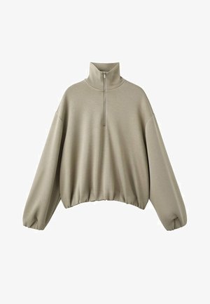 Beige langærmet pullover med høj krave, lynlås foran, vide ærmer og elastisk kant, vist på hvid baggrund.