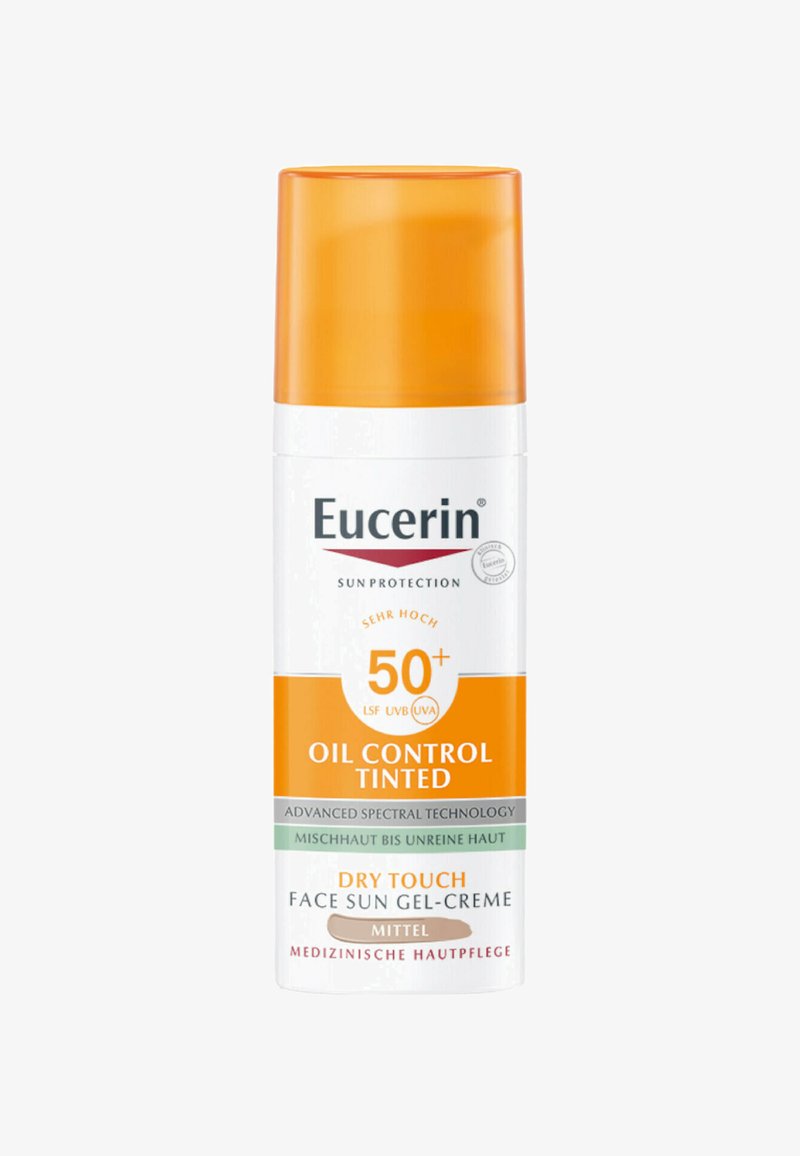 Eucerin Oil Control Tinted sunscreen in a white bottle with an orange cap. Features high SPF 50+, labeled as dry touch for mixed skin types.