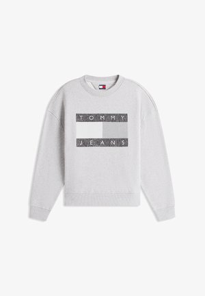 Γκρι φούτερ με μακριά μανίκια και ριμπ τελειώματα. Διαθέτει ορθογώνιο μαύρο και λευκό γραφικό με την επιγραφή "TOMMY JEANS" στο στήθος.