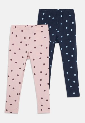 Two pairs of children's leggings, one pink with dark purple polka dots and one navy blue with light blue polka dots, elastic waistbands.