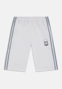 White athletic shorts with an elastic waistband, featuring two gray side stripes and a logo patch on the left leg. Smooth fabric texture.
